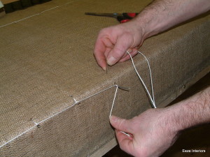 upholstered Sprung base being tied in and secured.